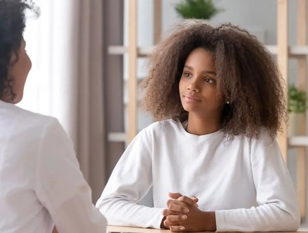Girl speaking with a mental health specialist